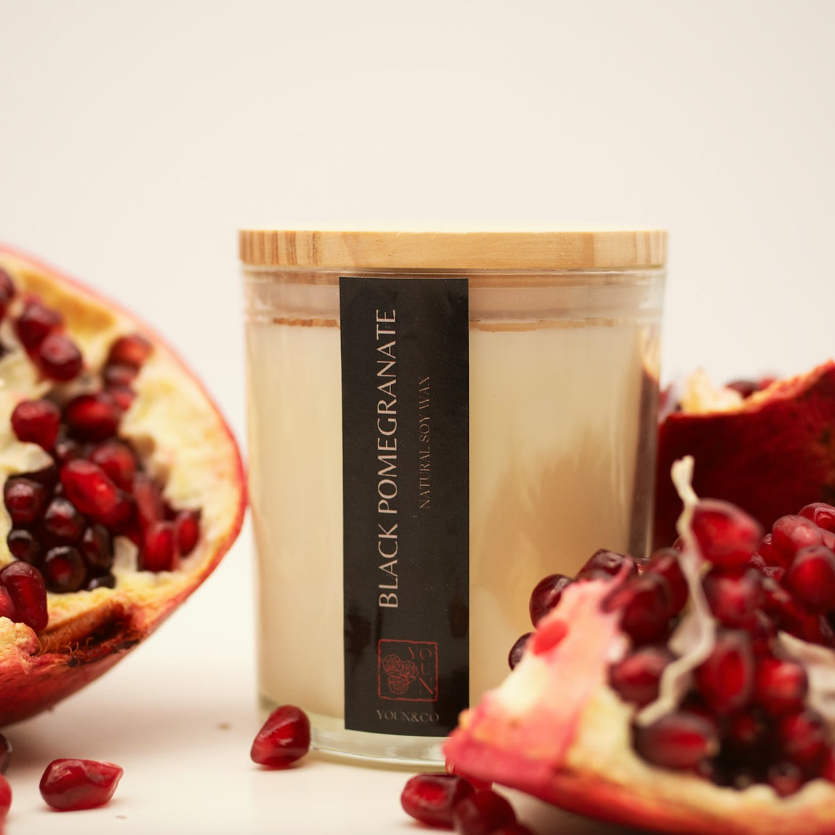Black Pomegranate candle with open pomegranates
